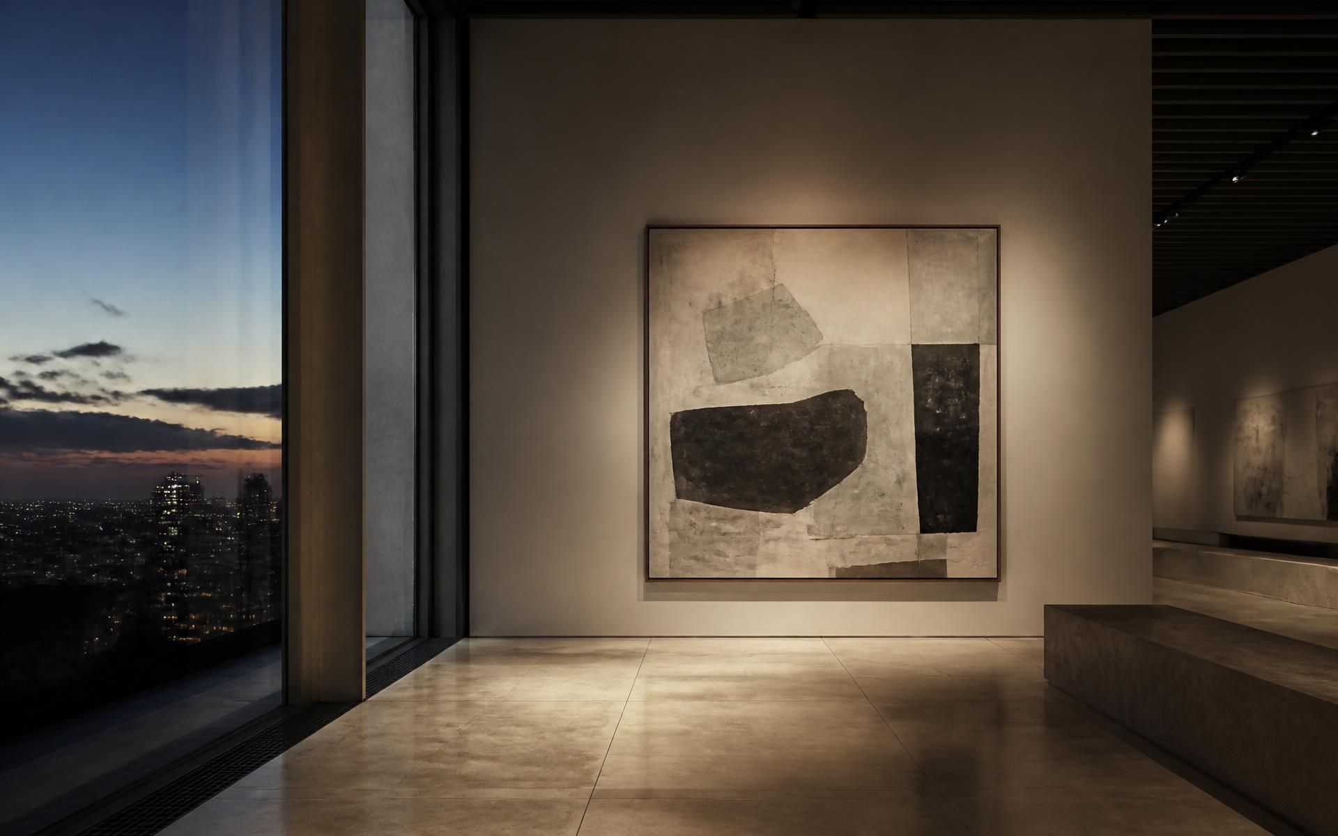 Contemporary gallery interior with a single illuminated painting